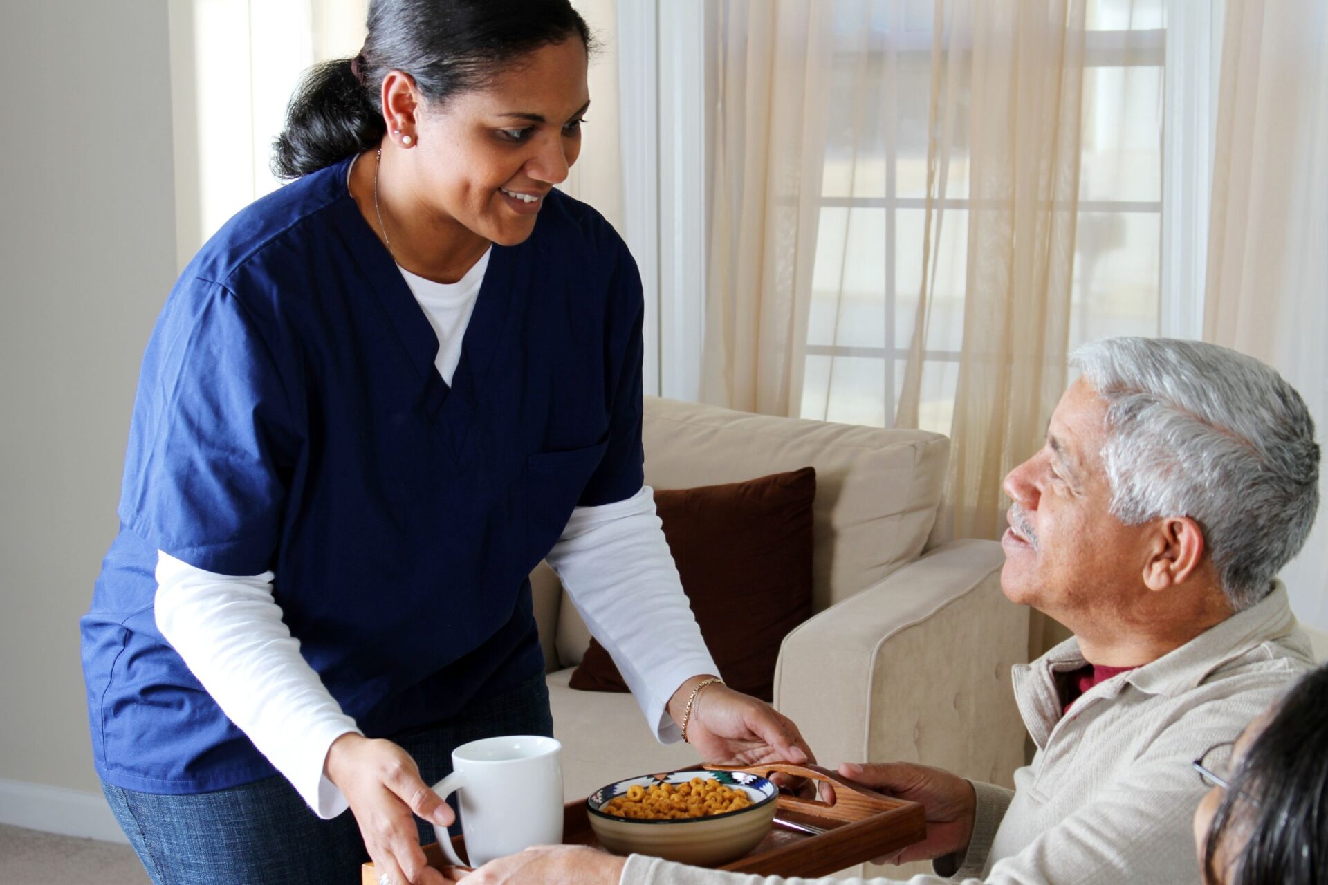 Caregiver helping senior outdoors
