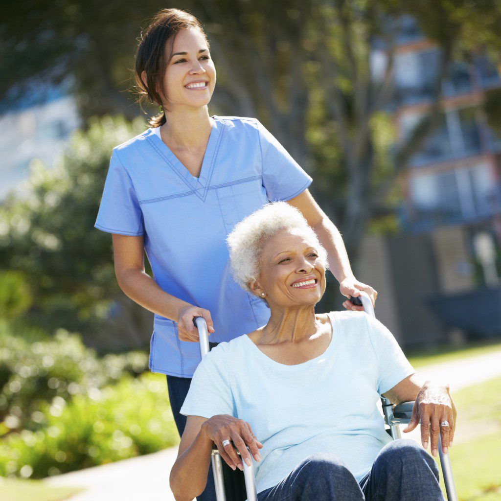 Caregiver serving senior a meal